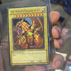 Golden and Brown Trading Card featuring a Dragon-like Creature